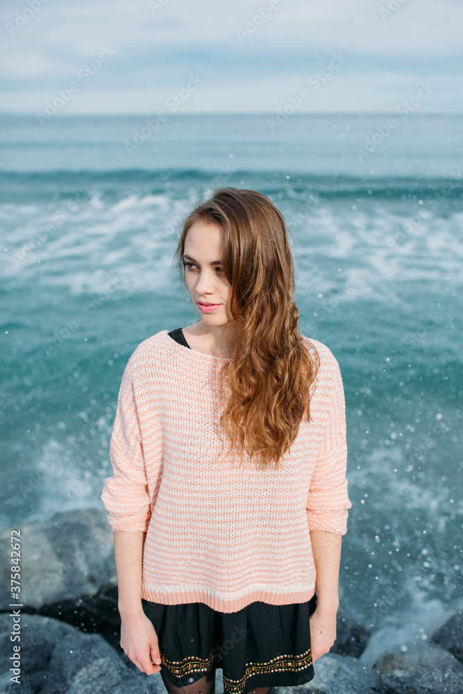 Portrait of beautiful woman with the sea in the background Portrait of beautiful woman with the sea in the background