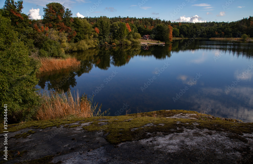 Sweden. Small house by the lake on an autumn day Sweden. Small house by the lake on an autumn day