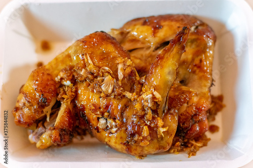Roast chicken sprinkled with garlic, delicious taste and appetizing.