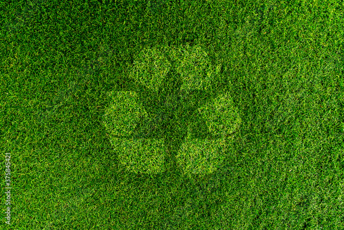 Show recycling symbol On the green grass