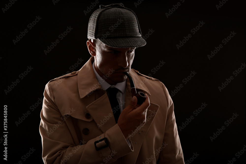 Old fashioned detective with smoking pipe on dark background Old fashioned detective with smoking pipe on dark background