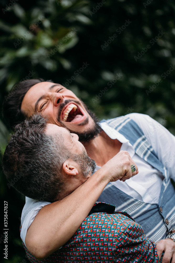 Happy gay couple having fun together Happy gay couple having fun together