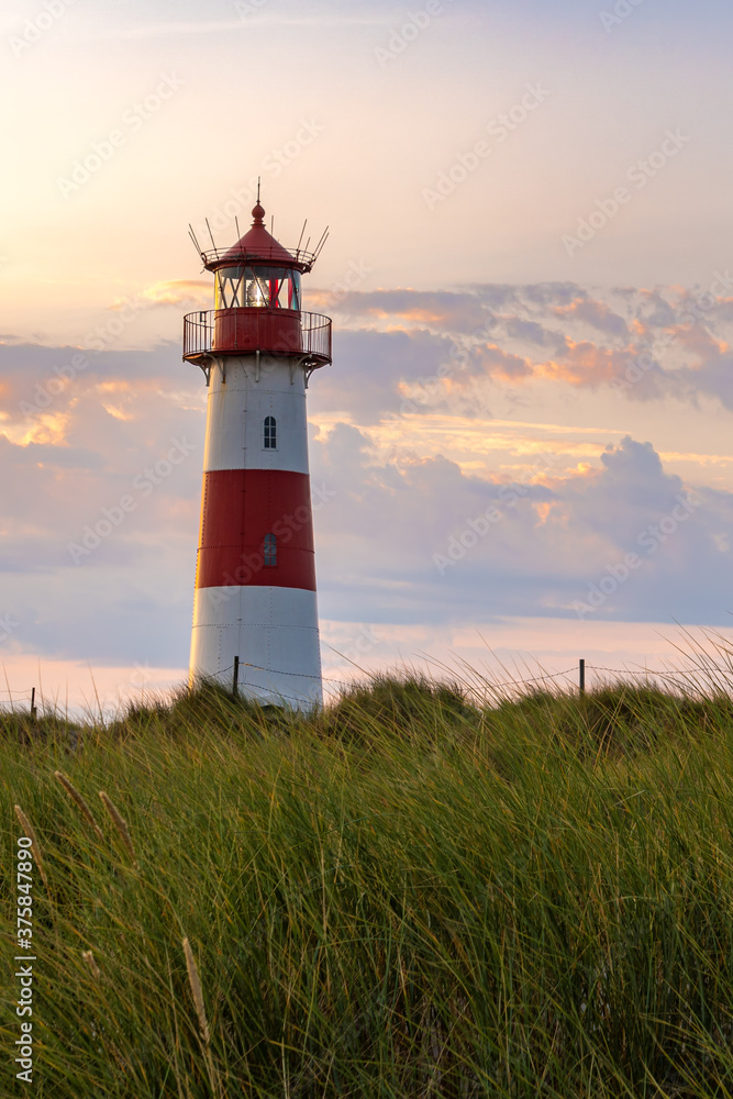 Lighthouse in front of an evening sky. Lighthouse in front of an evening sky.