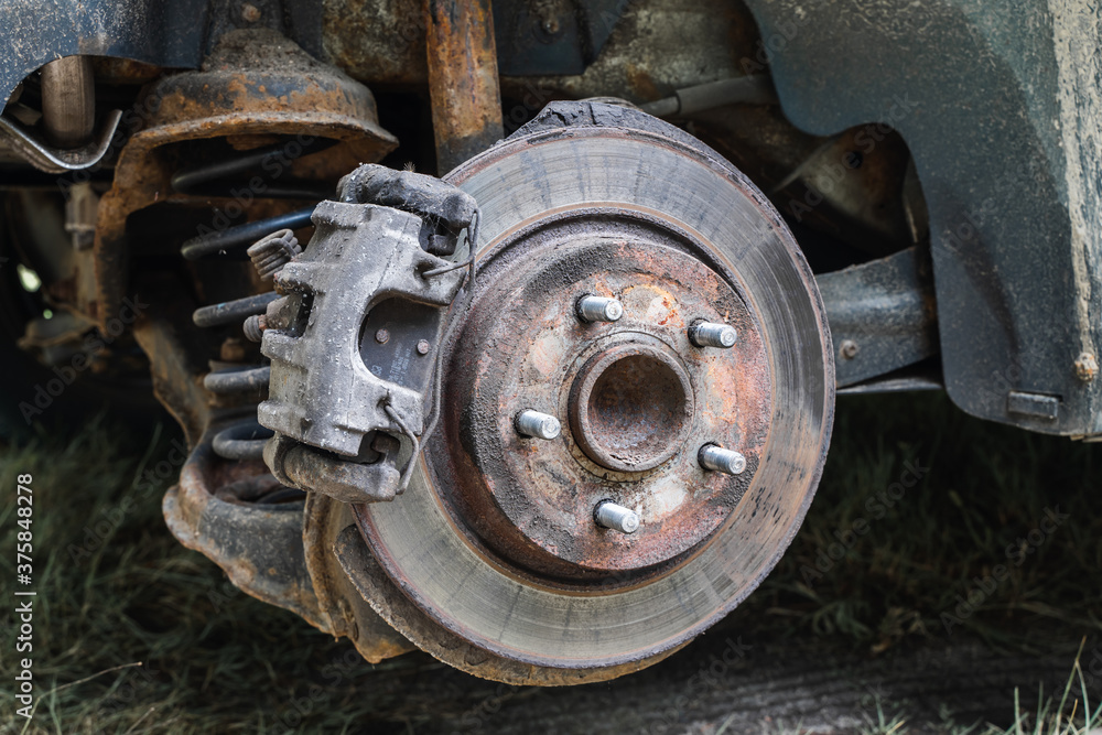 Front wheel car suspension. Brake disc and wheel hub of a car. Stock photo Front wheel car suspension. Brake disc and wheel hub of a car. Stock photo