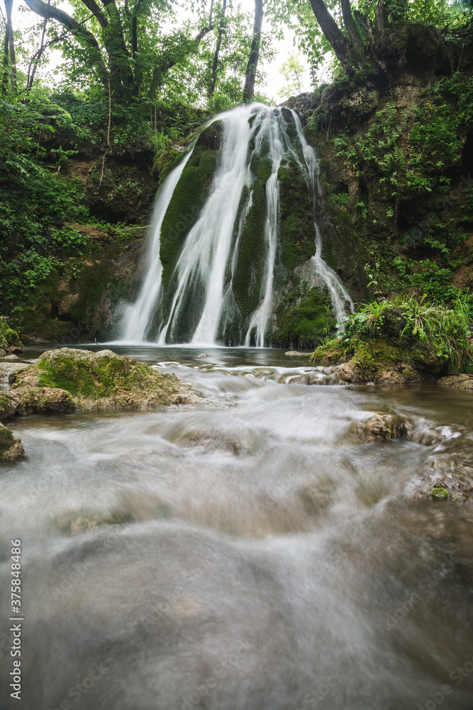 Fototapeta premium Beautiful waterfall in the forest near village Donji Taor, near city of Valjevo in Western Serbia