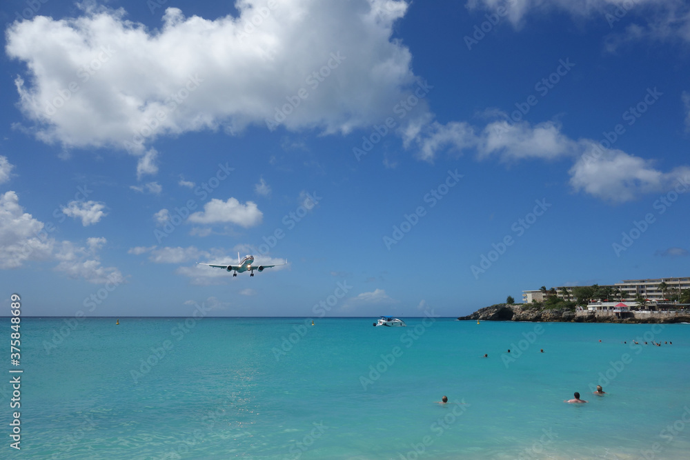 Airplane about to land on Sint Maarten in the Caribbean Airplane about to land on Sint Maarten in the Caribbean