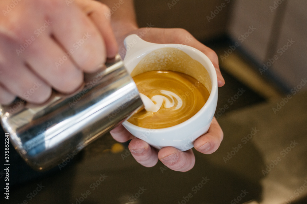 pouring latte cappuccino coffee, in cafe pouring latte cappuccino coffee, in cafe