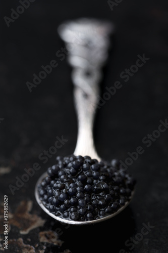 Lumpfish caviar in vintage spoon photo