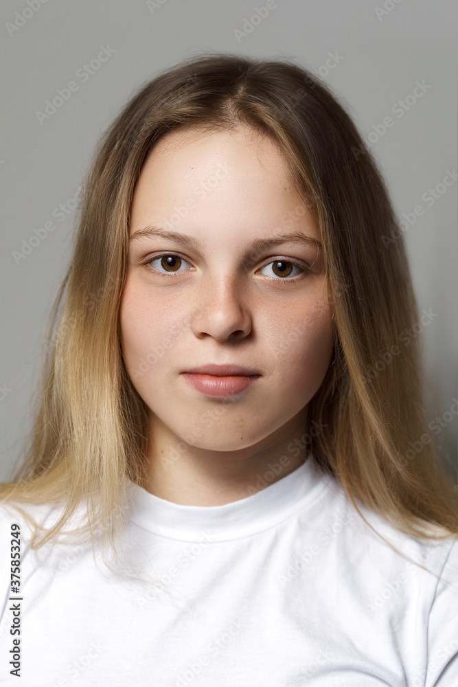portrait of a beautiful young 16 year old girl in a white t-shirt without makeup. natural beauty concept portrait of a beautiful young 16 year old girl in a white t-shirt without makeup. natural beauty concept