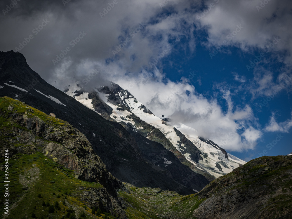 Dramatic and charming view to the highest mountain in Austria, Grossglockner with glaciers cover with snow. Hohe Tauern national park, near small city Heiligenblut, Austria, Europe.
