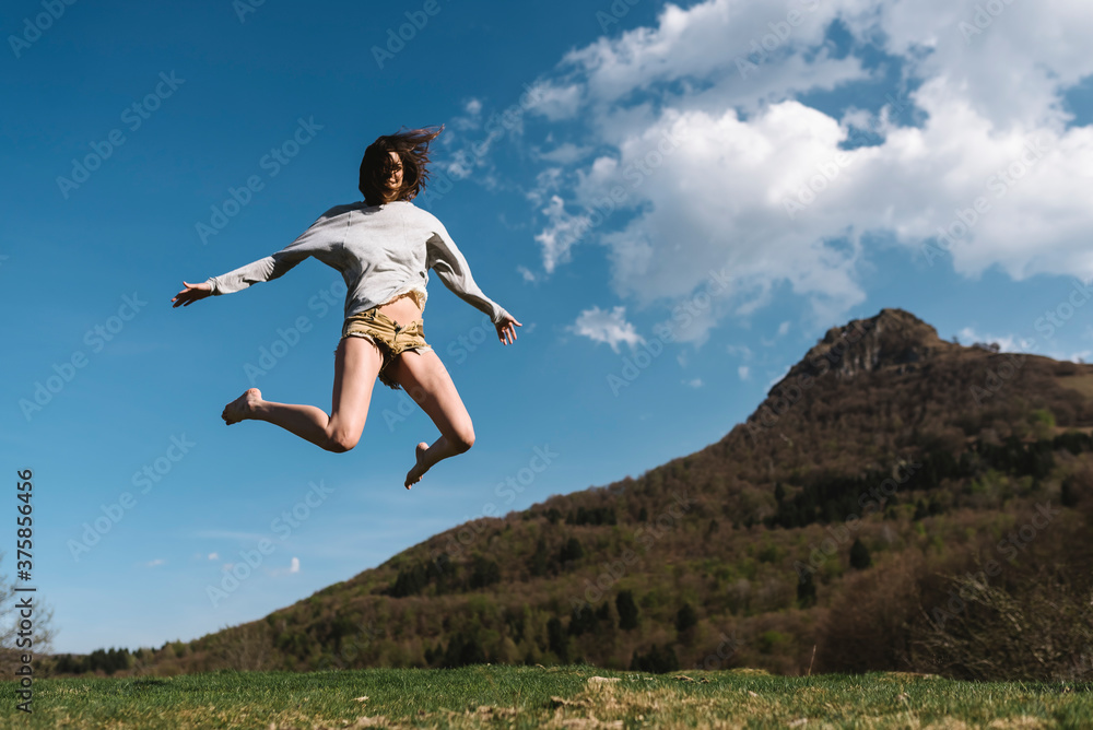 Young woman jumping in the nature Young woman jumping in the nature