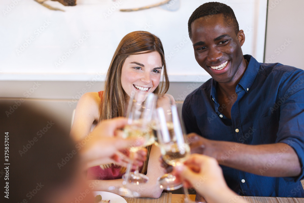 Group of friends making a toast with their wine glasses on a yacht. Group of friends making a toast with their wine glasses on a yacht.