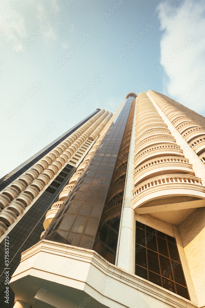 golden illuminated skyscraper under blue sky golden illuminated skyscraper under blue sky