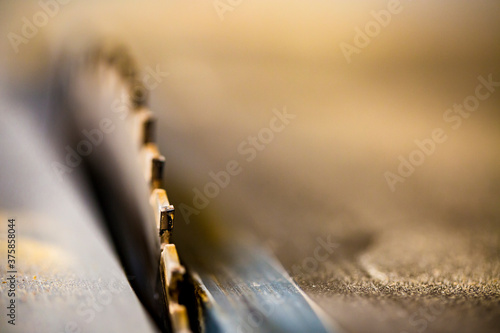 Closeup of a saw-blade in action photo