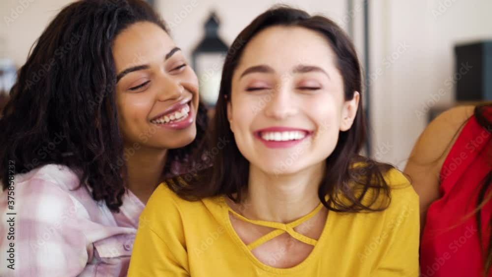 Arabian woman hugging her multiracial friends and showing engagement ring on hand. Happy females congratulating and smiling. Concept of joy Arabian woman hugging her multiracial friends and showing engagement ring on hand. Happy females congratulating and smiling. Concept of joy
