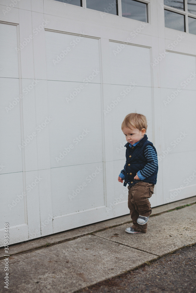 Cute young toddler boy outside walking Cute young toddler boy outside walking
