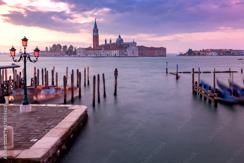 Large Venetian lagoon and promenade at dawn.
