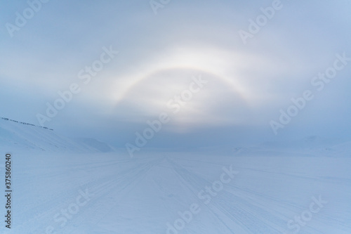 Halo effect on frosty Svalbard - ring of light visible around the svalbard sun.