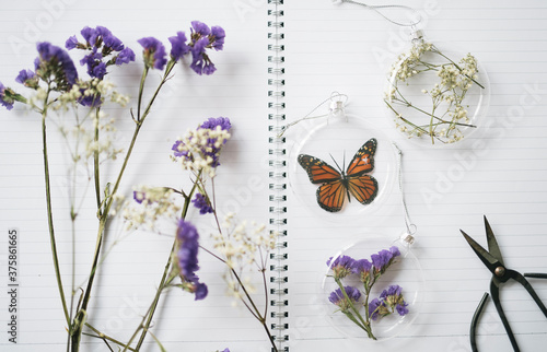 Beautiful DIY Christmas baubles made of dried flowers and glass photo