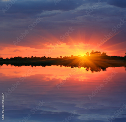 sunset over water surface