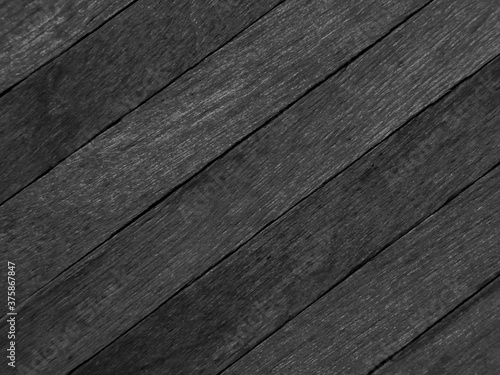 Background of black tone popsicle sticks with diagonal view. 