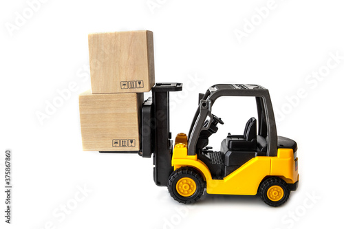 Miniature forklift truck with wooden block using as business competition concept
