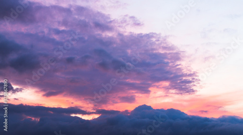 Blue purple sky with gray clouds. © alexmia