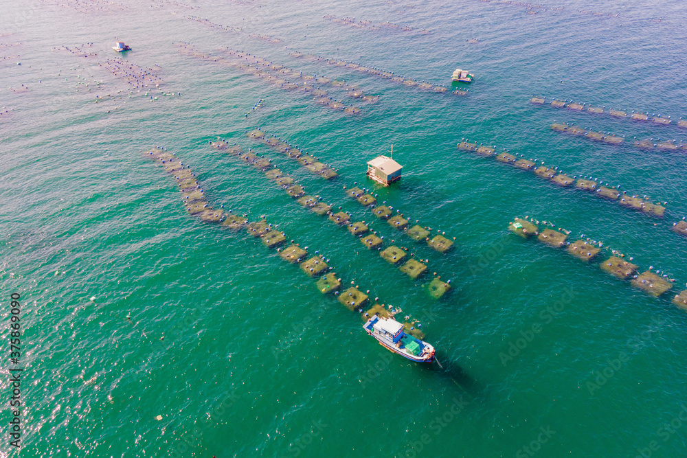 Lots of marine farms in a blue sea water. Sea farming concept Stock