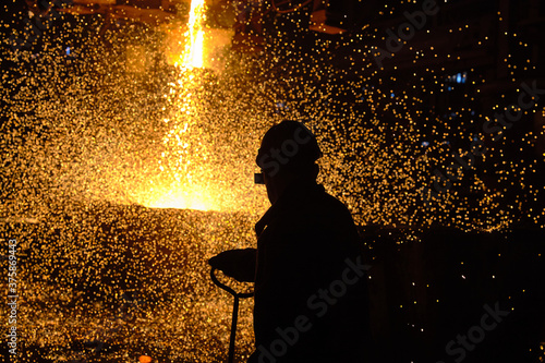 Steelmaker at ingot casting. Electric arc furnace shop EAF. Metallurgy.