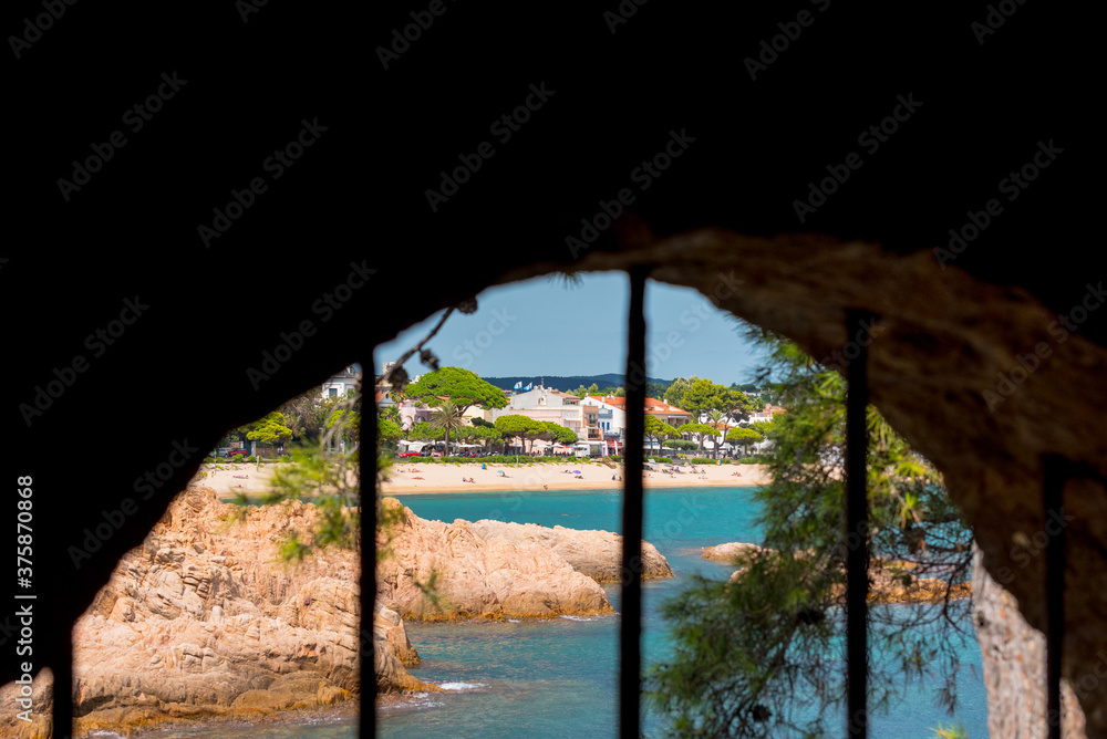 View to Village of Sant Feliu de Guixols at Costa Brava from tunnel in Catalonia,Mediterranean Sea,Spain