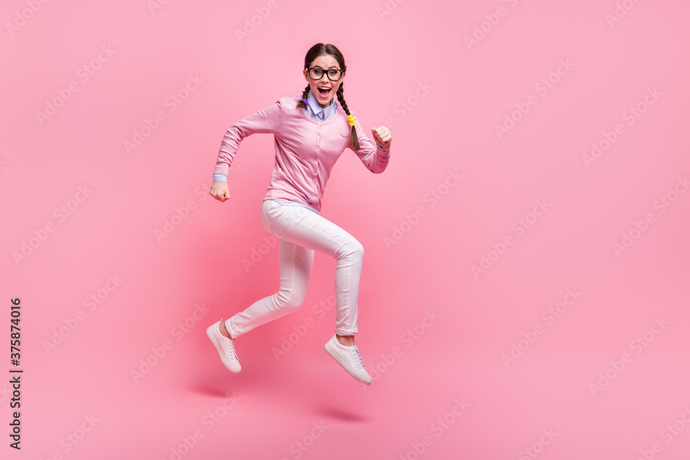 Full length body size view of her she nice attractive pretty lovely cheerful cheery funky sporty teen girl nerd jumping running lesson 1 September isolated pink pastel color background