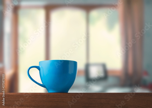 Blue cup on the table in the room