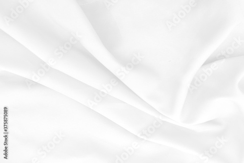 White cloth background abstract with soft waves. © Kavisara
