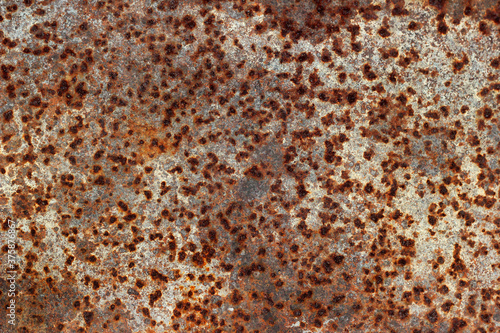 Rusty iron texture, caverns on metal surface © aquatarkus