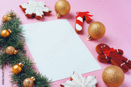 Mock up of holiday greeting card with gingerbread cookies on pink background