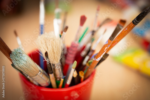 Close up of different paint brushes.
