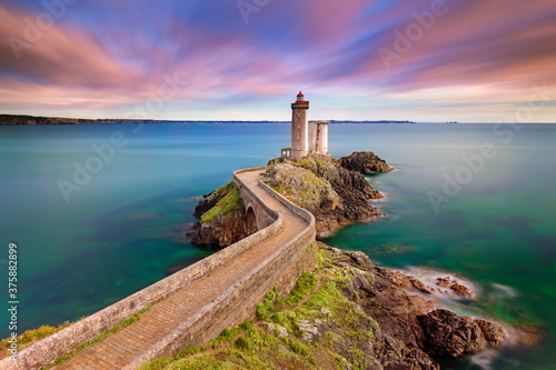 Petit Minou Lighthouse at sunset. It indicates to the boats wishing to go to Brest, the route to follow to enter the harbor. It forms an alignment with the Portzic lighthouse. It also has a red sector