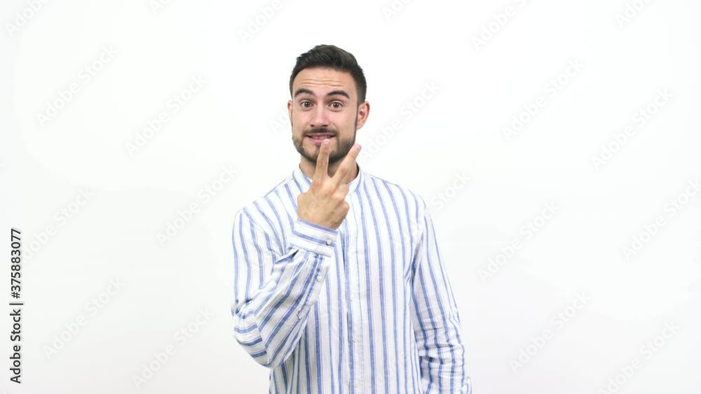 Young caucasian man fun and happy, positive and natural, doing a gesture of victory, peace concept Young caucasian man fun and happy, positive and natural, doing a gesture of victory, peace concept