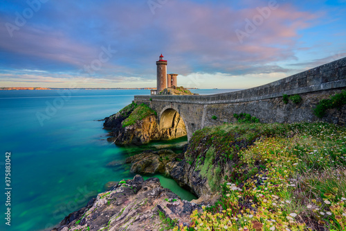 Petit Minou Lighthouse at sunset. It indicates to the boats wishing to go to Brest, the route to follow to enter the harbor. It forms an alignment with the Portzic lighthouse. It also has a red sector