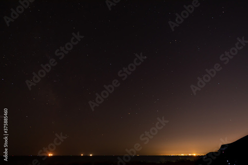 Real Night Sky Stars Background With Natural Colourful Sky Gradient. Sunset, Sunrise Light And Starry Sky. Yellow And Black Colors.