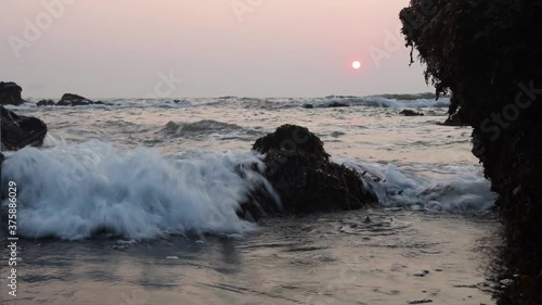 Movement of waves of the tropical ocean to the rocks.