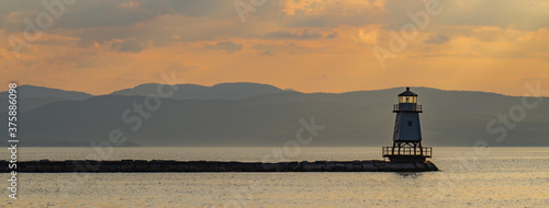 banner photo of the lighthouse at sunset on the waterfront of Lake Champlain in Burlington, Vermont 