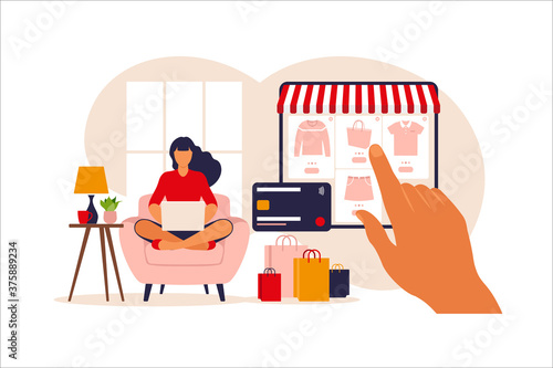 Woman shopping online on laptop. Vector illustration. Online store payment. Bank credit cards. Digital pay technology. E-paying. Flat style modern vector illustration.