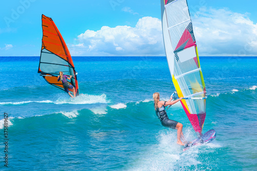 Beautiful cloudy sky with windsurfer surfing the wind on waves in Alacati - Cesme, Turkey  © muratart