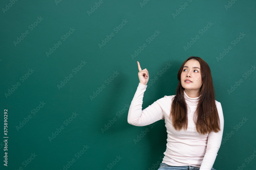 women with pointing finger on chalk board