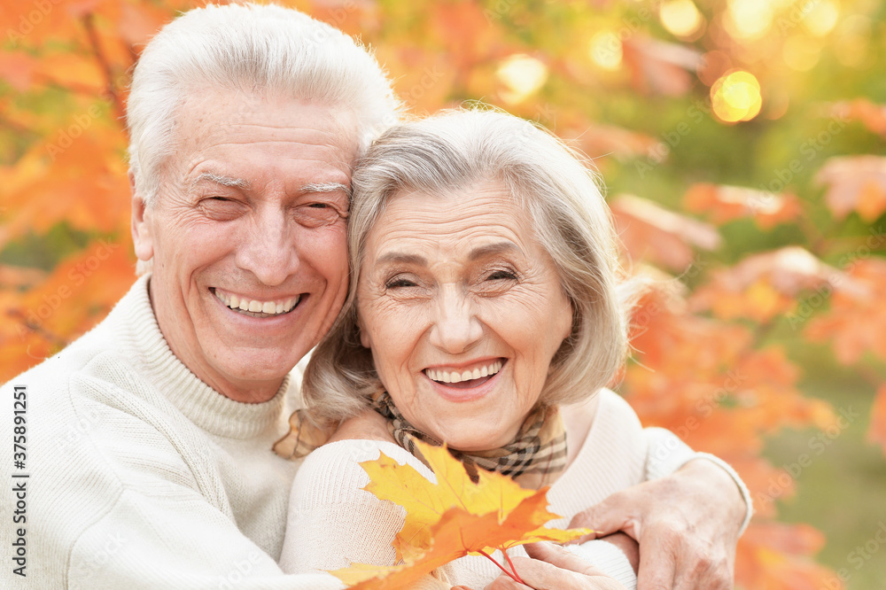 Beautiful happy senior couple with autumn leaves Beautiful happy senior couple with autumn leaves