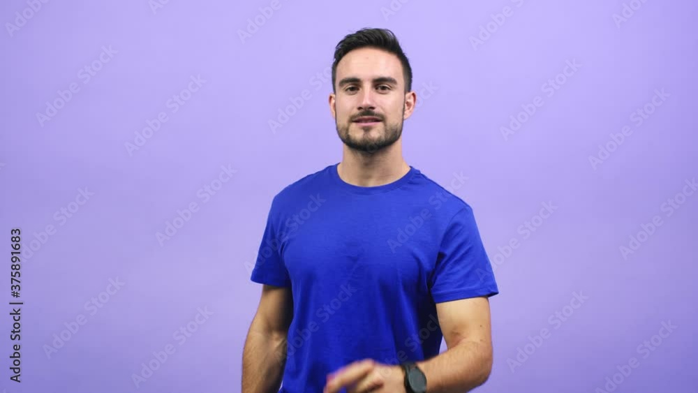 Young caucasian man inviting to come, confident and smiling doing a gesture with hand, being positive and friendly Young caucasian man inviting to come, confident and smiling doing a gesture with hand, being positive and friendly