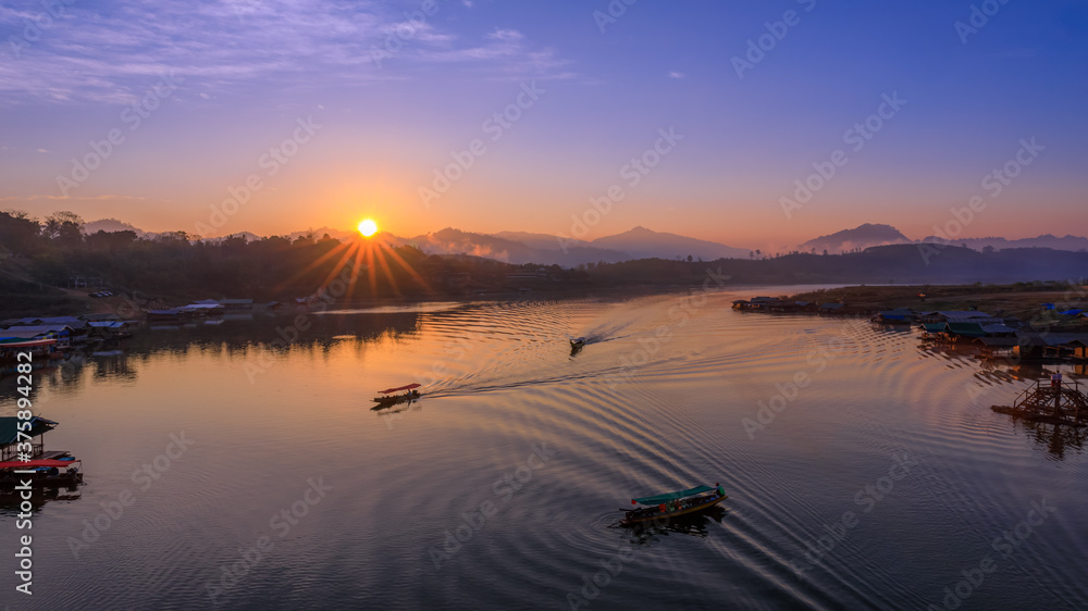 landscape view morning the sunrise and long tail boat sailing in the.river