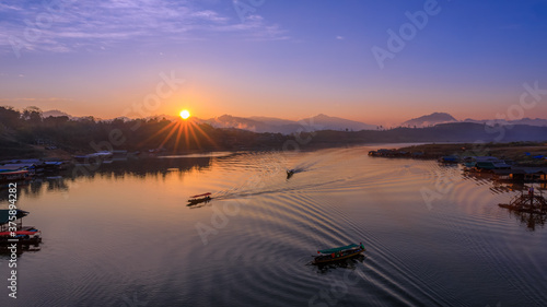 landscape view morning the sunrise and long tail boat sailing in the.river