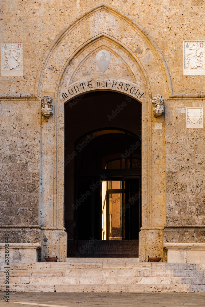 Entrance door to the main office of the Banca Monte dei Paschi di Siena, one of the oldest banks in the world. The building is the  Palazzo Salimbeni, a Gothic style palace on the Piazza Salimbeni.